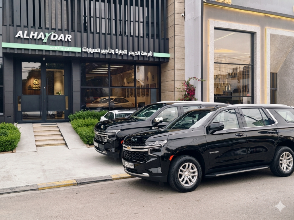 Photo showcases car rental options available, parked in front of Baghdad Office - Al Haydar Rent a Car